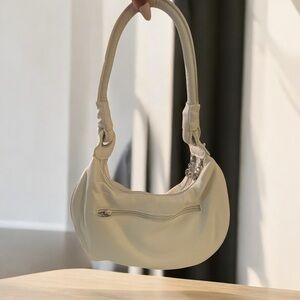 Chic White Crescent Shoulder Bag with Metal Hardware